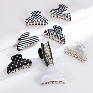 8-piece set of black and white pattern acrylic hair claws in assorted chic designs