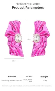 Detail view of metallic rose pink wrinkled earrings with glass crystal parameters