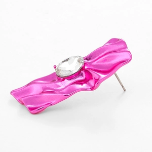 Cyberpunk metallic rose pink wrinkled earrings with a white crystal statement stud