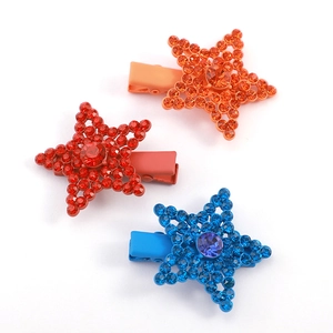 Three rainbow matte star hair clips with rhinestones in orange, red and blue colors