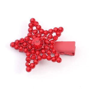 Detail shot of red star hair clip with rubber paint finish and shimmering rhinestones