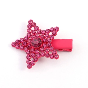 Detailed view of pink pentagram hair clip with sparkling rhinestones and metal base