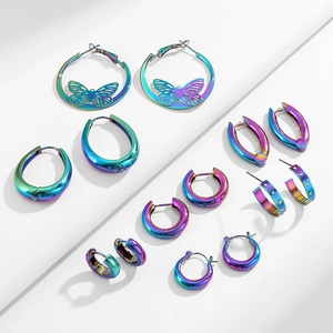 Detailed set of iridescent holographic hoop earrings in various Y2K styles on white plates