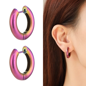 Detailed view of colorful holographic metal hoop earrings with rainbow gradient finish