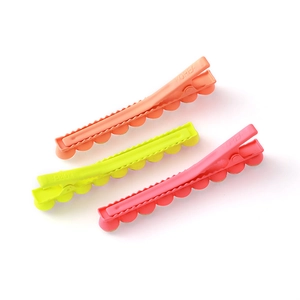 Three-piece set of fluorescent neon alligator hair clips with scalloped edges and matte finish