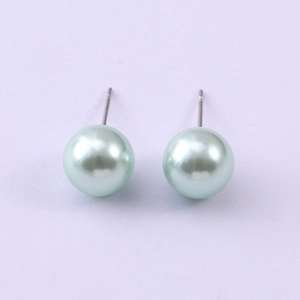 Close-up of 8mm mint green faux pearl studs with high gloss finish and silver posts