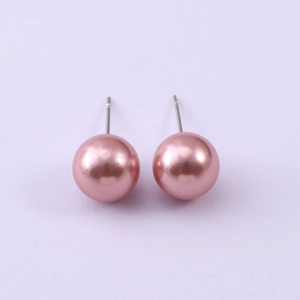 Detailed close-up of 8mm pink faux pearl stud earrings with silver metal posts