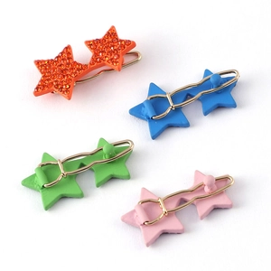 Set aus vier sternförmigen Haarspangen in Orange, Blau, Grün und Pink mit Strass-Details