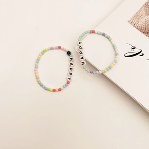 Ensemble de bracelets HAPPY en perles macaron de style bohème avec œil protecteur