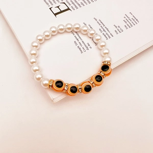 Detailed macro view of Turkish evil eye beads with baroque pearls and crystal spacers