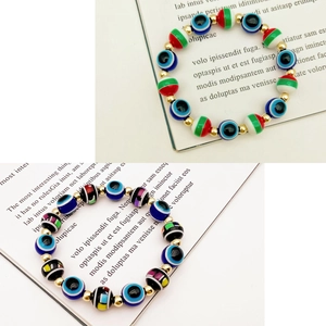 Colorful Evil Eye and Fatima Palm beaded stretch bracelets with vibrant festive patterns