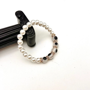 Close-up of Baroque pearl bracelet with evil eye beads and sparkling spacers