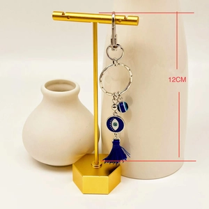 Detail view of 12cm Turkish evil eye car hanging charm with blue tassel and silver accents