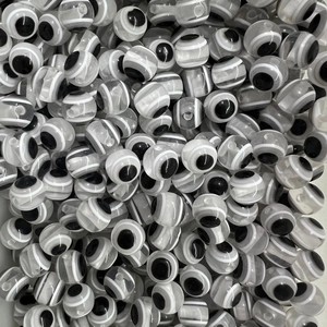 Macro shot of black, white and grey resin evil eye beads for DIY jewelry making