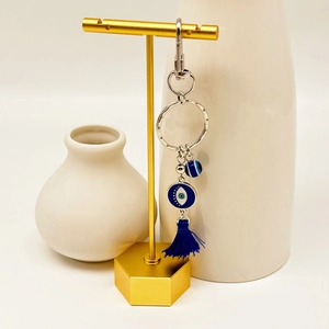 Detail of Turkish evil eye car hanging ornament with blue tassels and lobster clasp