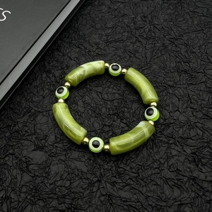 Turkish Evil Eye beaded bracelet with green marble cylinders and gold-tone spacers