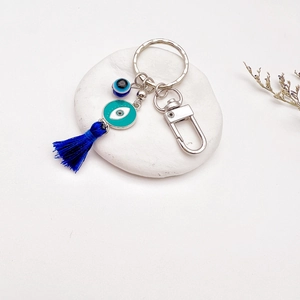 Blue Turkish Evil Eye keychain with silver metal ring and dark blue tassel accessory