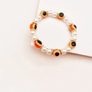 Pulsera bohemia de ojo turco con perlas blancas y espaciadores dorados de estilo étnico
