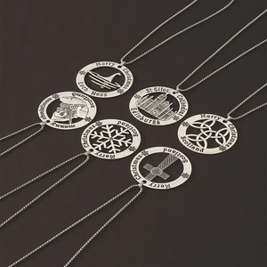 Detailed close-up of various hollow round pendants with Scottish and Christmas motifs