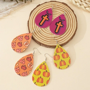 Three pairs of Halloween teardrop leather earrings with pumpkin and bat patterns