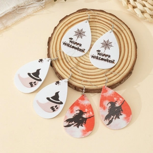 Three pairs of Halloween teardrop earrings with spider web, ghost, and witch designs