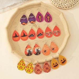 Detail of faux leather teardrop earrings featuring Halloween pumpkin and spider patterns
