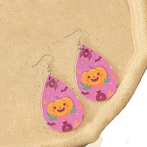 Detail view of teardrop Halloween earrings with pumpkin and bat prints on purple faux leather