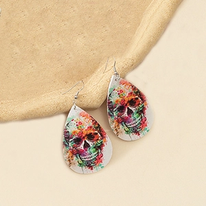 Macro detail of double-sided PU leather teardrop earrings with colorful skull patterns