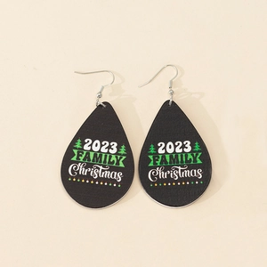 Detail view of teardrop wooden earrings with 2023 Family Christmas print and silver hooks