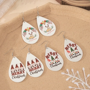 Three pairs of wooden teardrop Christmas earrings with gnome and reindeer patterns