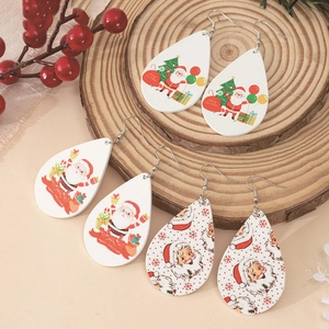 Three pairs of Christmas teardrop wood earrings with Santa and tree patterns