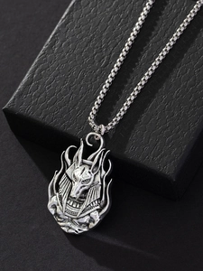 Close-up of vintage Anubis pendant necklace in silver finish with detailed box chain