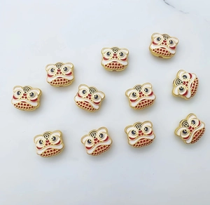 Macro shot of 11 colorful lion dance pendants with enamel finish for DIY jewelry making