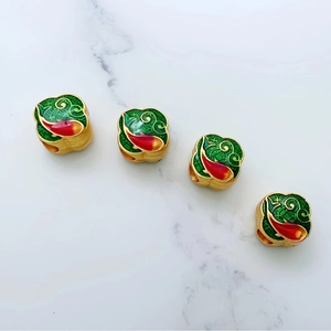 Golden koi fish enamel beads for DIY jewelry with vibrant red and green patterns