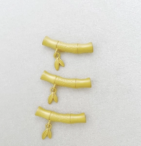 Three gold bamboo pendants for DIY jewelry with sandblasted texture and small leaf charms