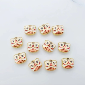 Set of traditional Chinese dancing lion charms in gold finish with red and white enamel