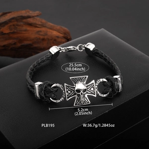 Gothic woven leather bracelet for men featuring a vintage silver cross and skull charm