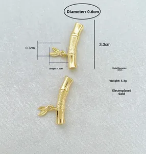 Detailed gold bamboo tube connector with leaf charm for DIY jewelry making projects