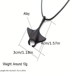 Punk style matte black manta ray pendant necklace with leather cord on white background