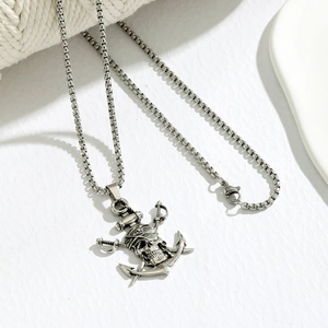 Detailed punk pirate skull pendant with crossed swords and anchor in antique silver finish