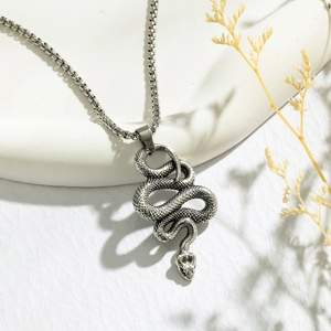 Retro silver snake pendant necklace with detailed scales on a round box chain