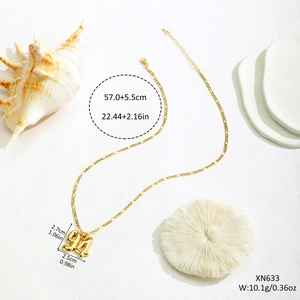 Golden number 94 pendant necklace with Figaro chain on a minimalist white background