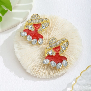 Close-up of red enamel snowman and fashion lady earrings with crystal details