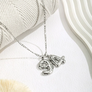 Macro view of silver number 94 pendant with sparkling rhinestones on delicate chain