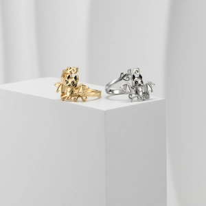 Detailed macro view of stylish gold and silver bat rings with textured twist bands