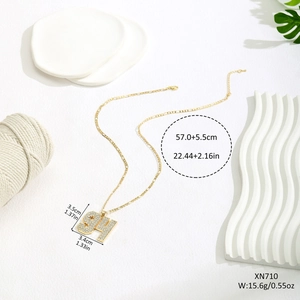 Close-up of gold number 94 pendant necklace with crystals on Figaro chain with dimensions