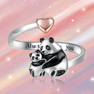 Detailed macro view of panda family open ring with rose gold heart and engraved band