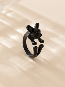 Detailed macro shot of a glossy black French Bulldog ring with adjustable open band