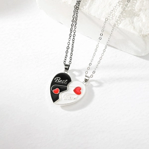 Detail of magnetic heart-shaped best friend necklace set with black and silver finish