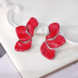 Detailed view of red gradient petal earrings with gold alloy frame and marble texture